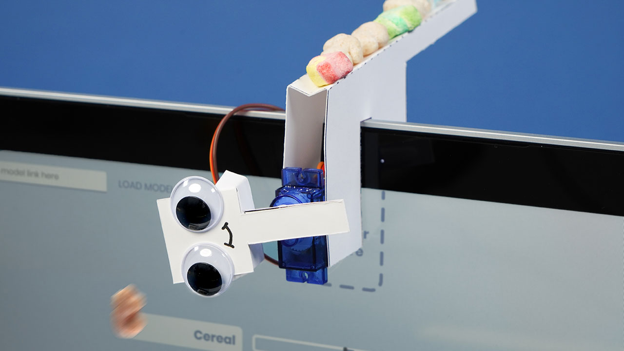A webcam with googley eyes controlled by a machine learning model trained with teachable machine